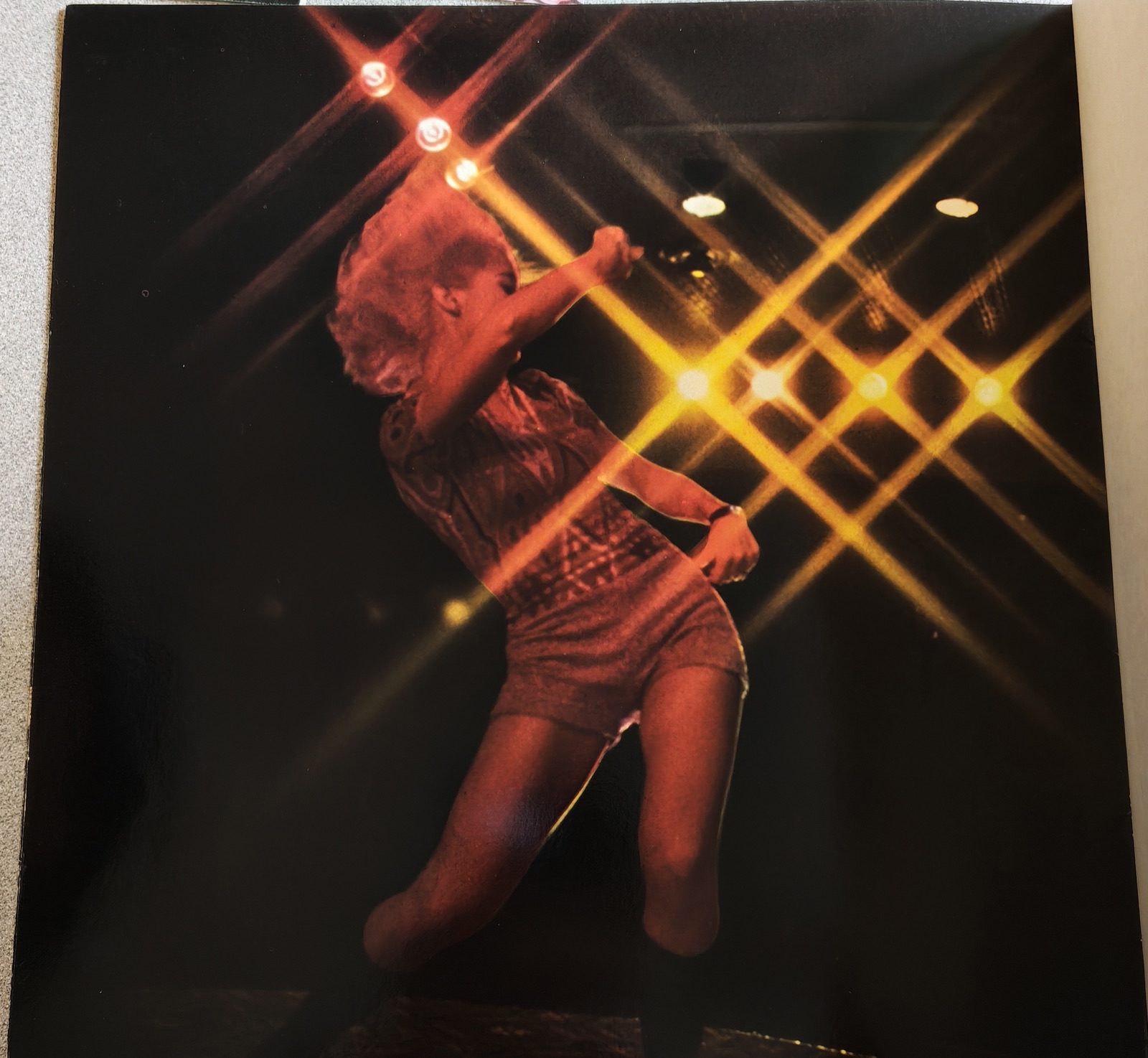 A performer under starburst lights